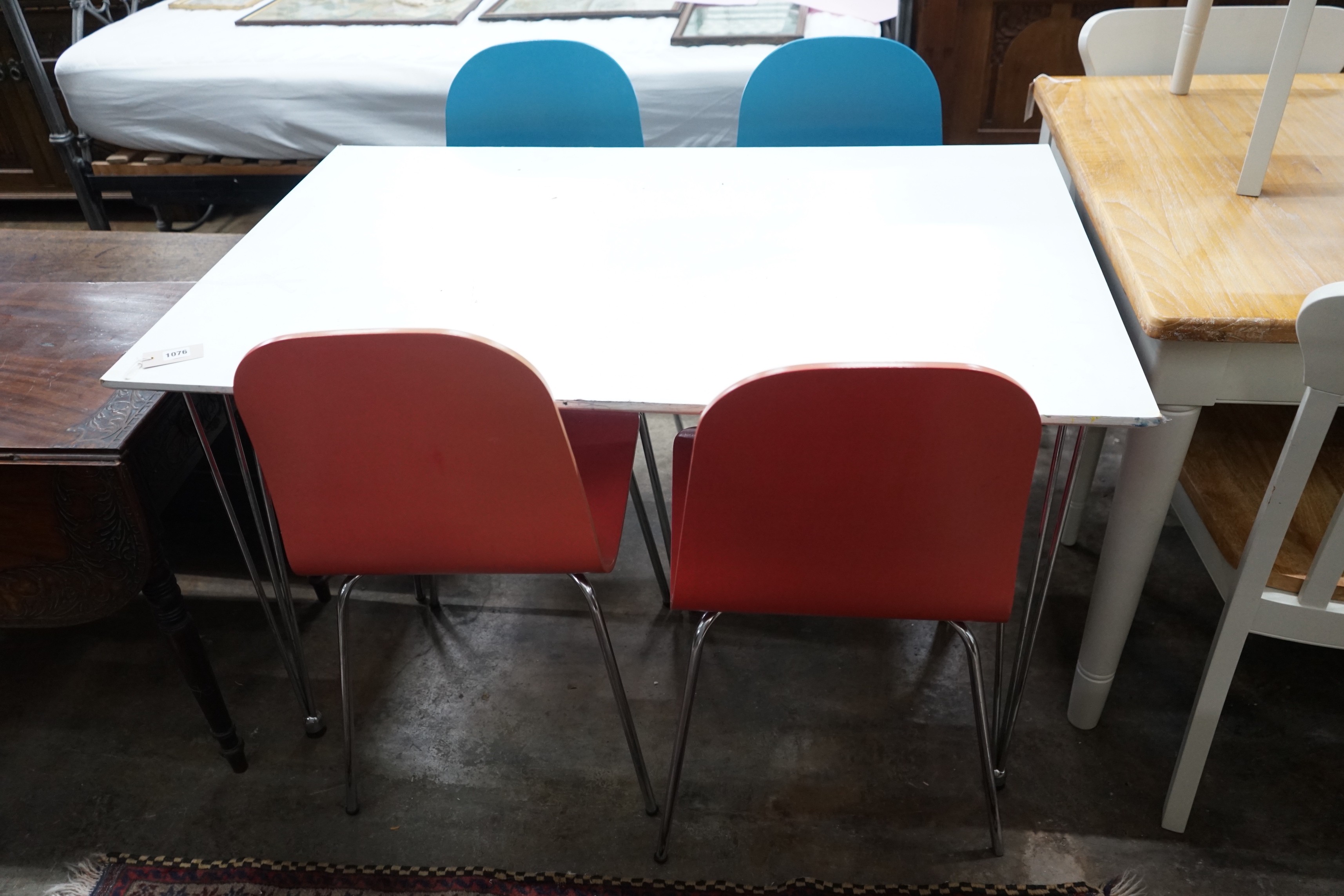 A contemporary John Lewis painted ply and chrome table and four chairs, table width 120cm, depth 76cm, height 73cm